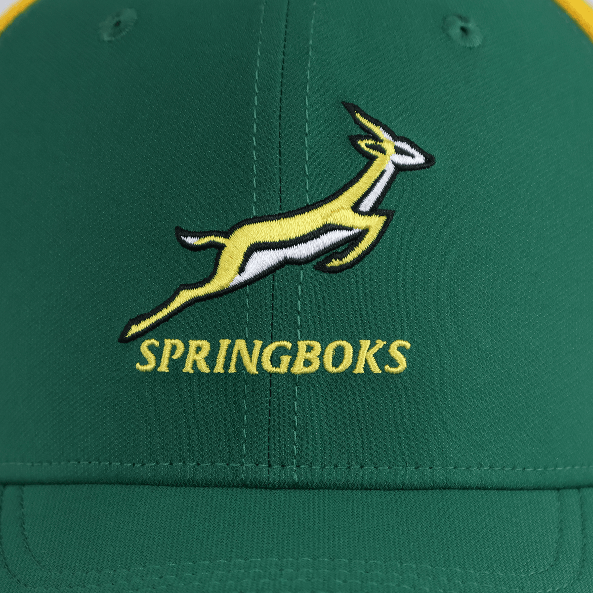 The Nike Springboks 26/27 Trucker Cap features a green design with an embroidered yellow and white leaping springbok logo above "SPRINGBOKS" in yellow text.