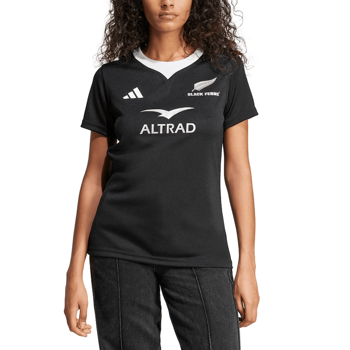Wearing the Women's Black Ferns 24/25 Home Supporters Jersey by adidas, featuring logos on a crisp white backdrop and AEROREADY technology for comfort and breathability, mirrors the preferences of New Zealand's women's rugby team on their victorious journey.