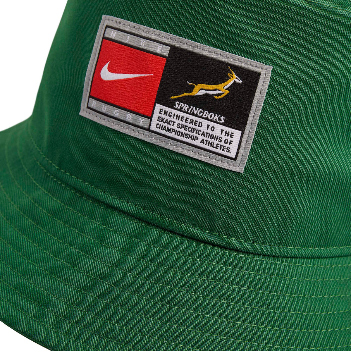 A green Nike Springboks Apex Bucket Hat featuring a rectangular patch with the team logo and text.