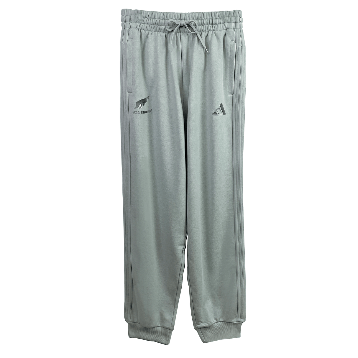 Women's All Blacks 24/25 Fan Cuffed Pant by adidas: Gray athletic pants with drawstring, pockets, and New Zealand rugby team branding alongside the adidas logo. Ideal for any fan wear collection or as part of the All Blacks Women's Pant range.