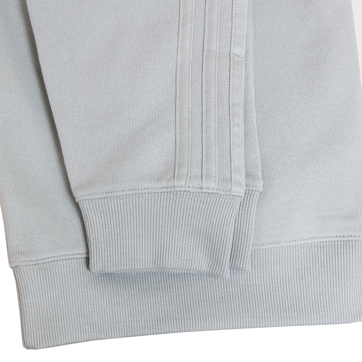 Close-up of the cuff and hem on the Women’s All Blacks 24/25 Fan Crewneck Sweatshirt by adidas, highlighting the ribbed texture and seam details—an essential for women’s fan apparel.