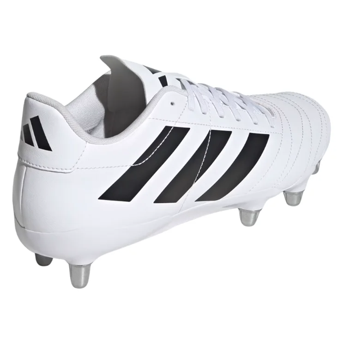The adidas Kakari SG in White/Core Black/Silver Metallic features black stripes and metal studs for soft ground, shown here from the back and side.