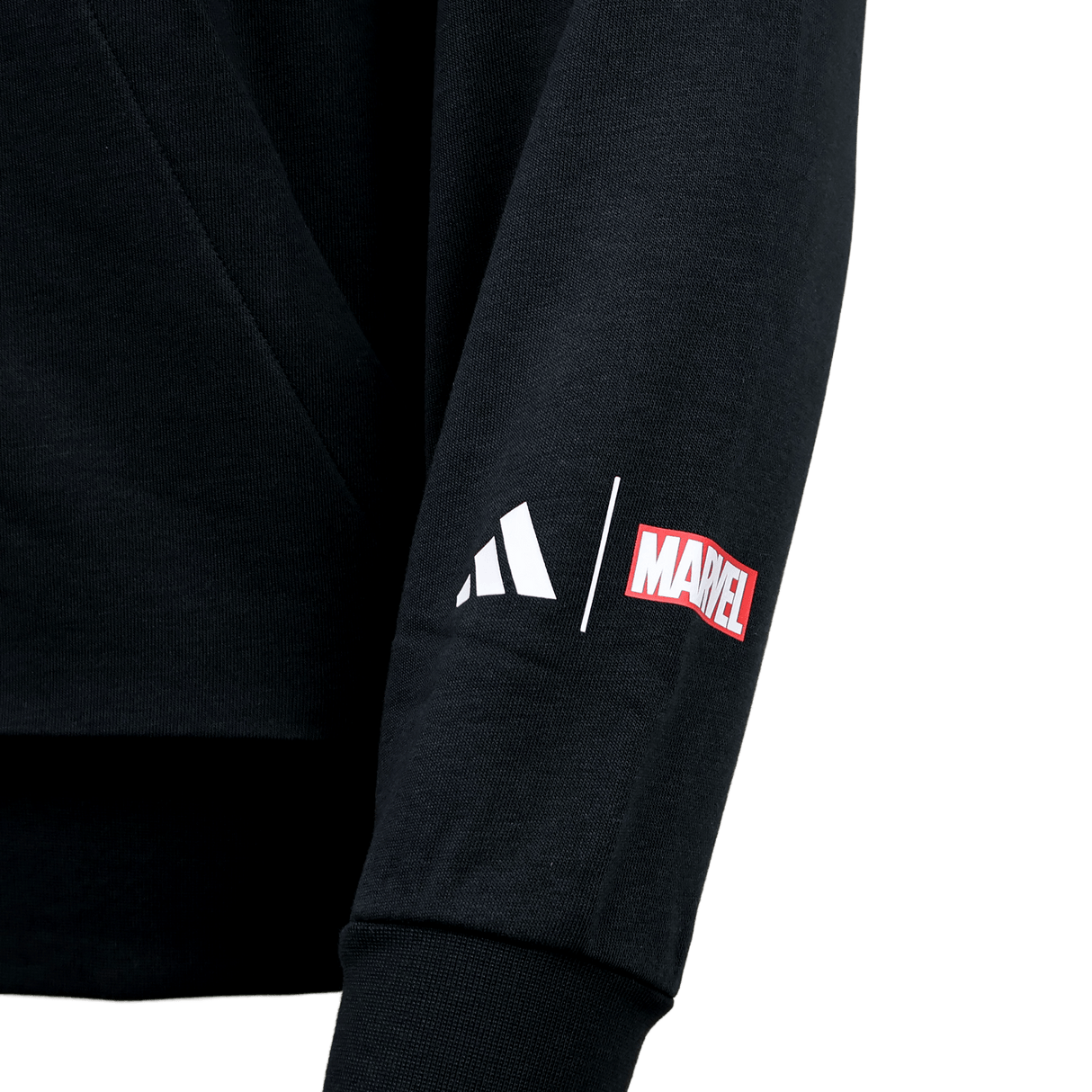 A close-up of the All Blacks 26/27 Marvel Hoodie by adidas shows its black sleeve with white adidas and red Marvel logos printed side by side.