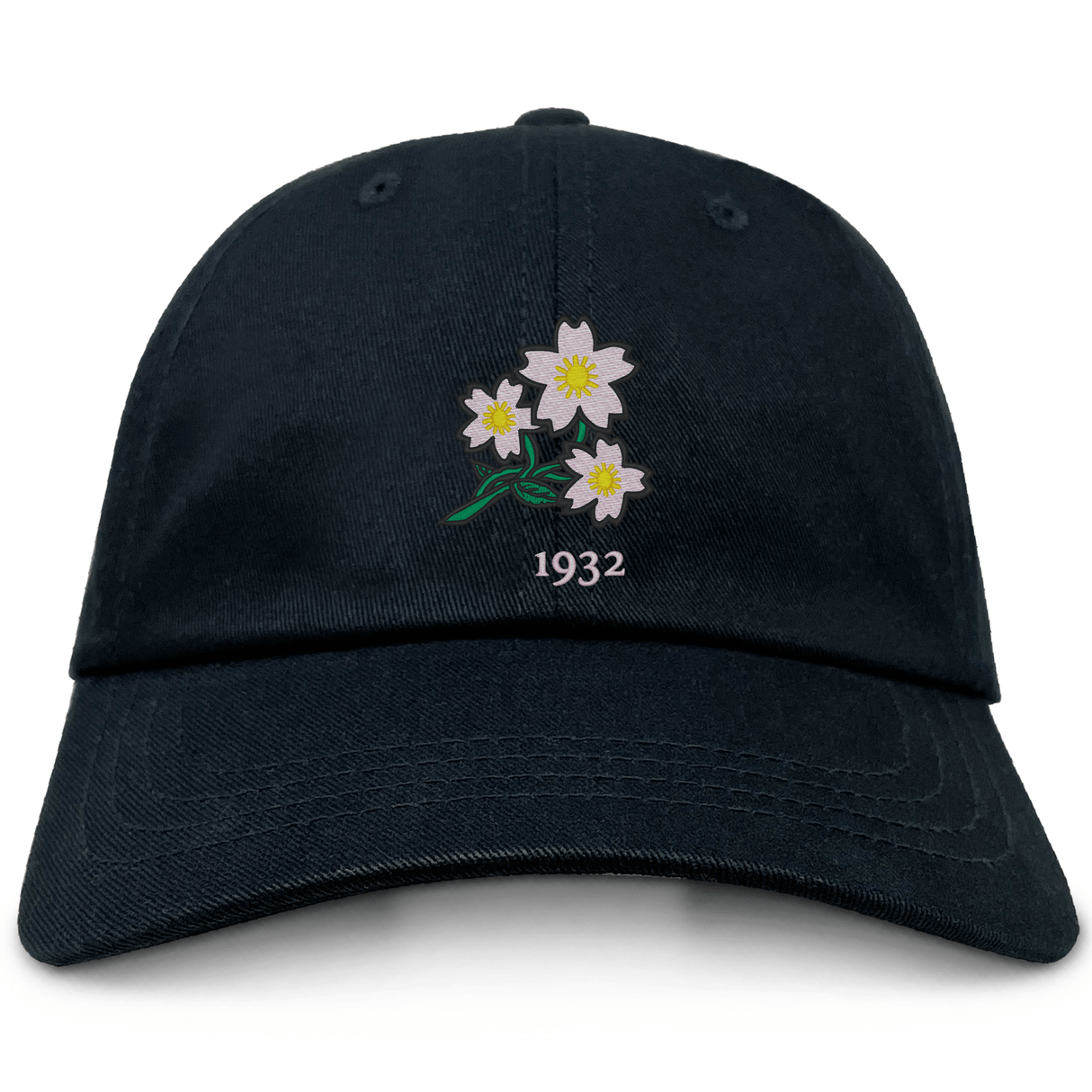 The Nations of Rugby Japan Vintage Dad Cap by EMB S&S Activewear is a black cap with an embroidered design of three white flowers and green leaves above the number "1932.