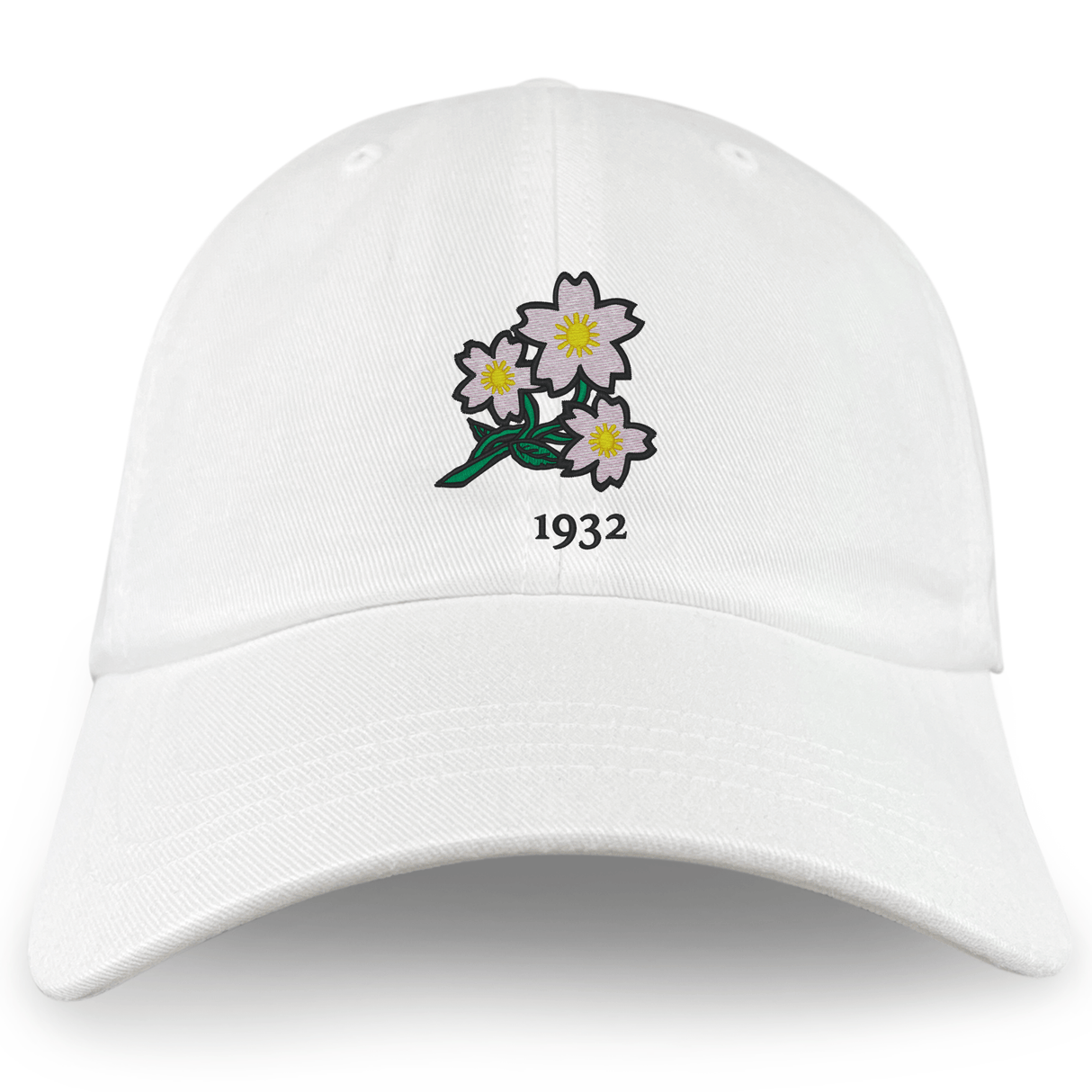 The Nations of Rugby Japan Vintage Dad Cap by EMB S&S Activewear features an embroidered design of three white flowers with green stems and "1932" below—a subtle tribute to rugby heritage.