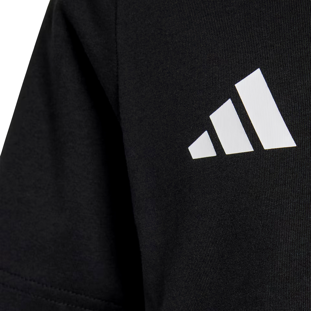 Close-up of black fabric with a white adidas logo and three diagonal stripes, from the All Blacks 26/27 Marvel Leisure Tee by adidas, celebrating New Zealand rugby.