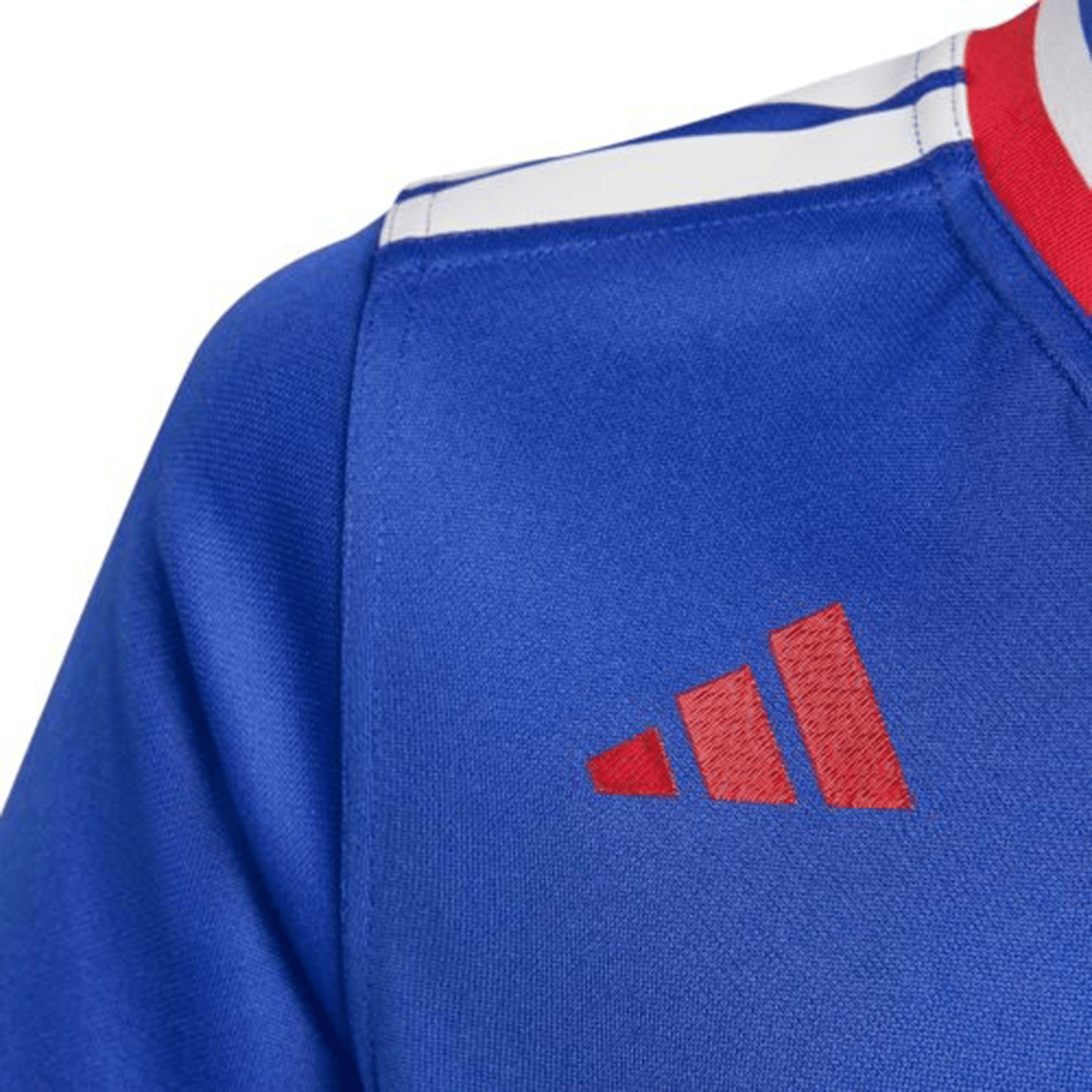 Close-up of the France FFR 25/26 Replica Home Jersey by adidas—blue with a red collar, white shoulder stripes, and a red adidas logo on the chest.