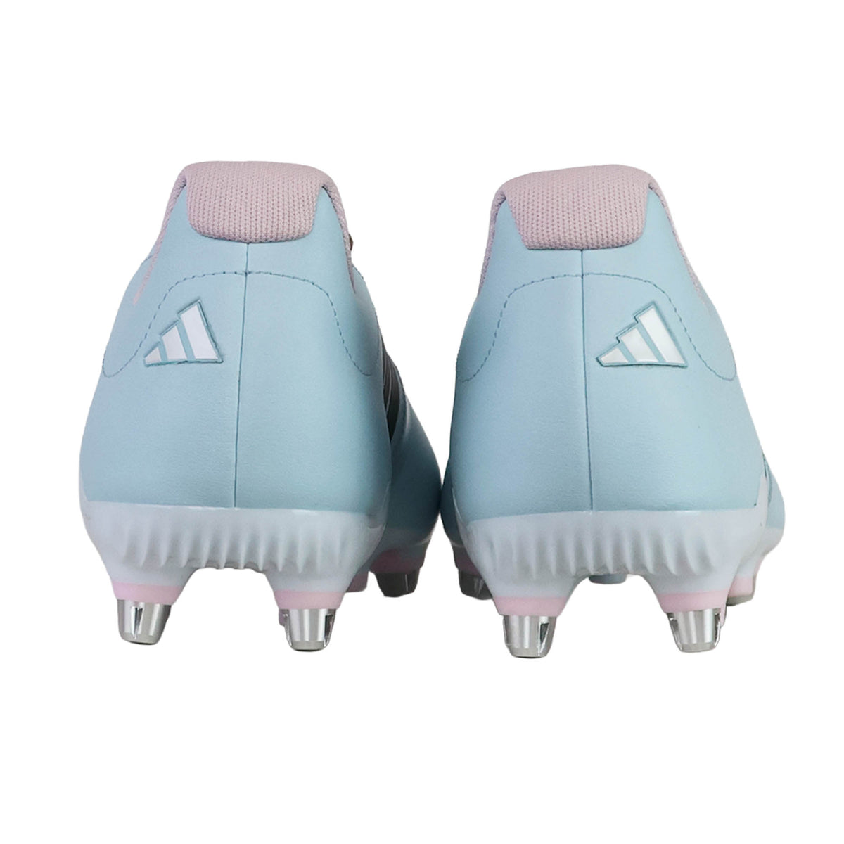 Back view of a pair of adidas RS-15 Avaglide Rise SG rugby boots in Ice Blue, Iron, and Pink with metal studs, displayed on a white background.