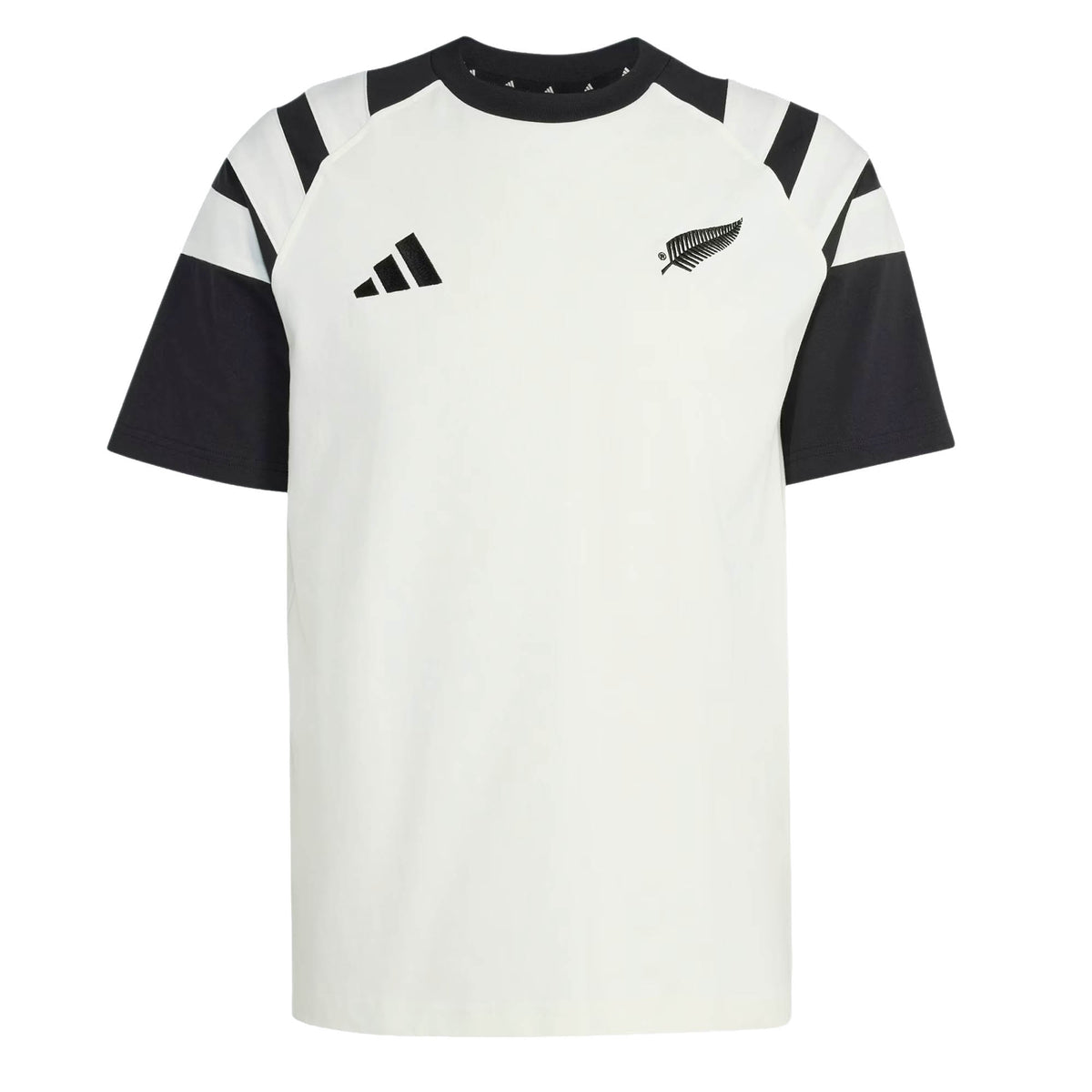 The All Blacks 26/27 Travel T-Shirt by adidas is a white and black short-sleeve shirt featuring a striking black fern and the adidas logo on the chest, along with bold black angled stripes on the shoulders—a classic look inspired by the iconic New Zealand rugby shirt.