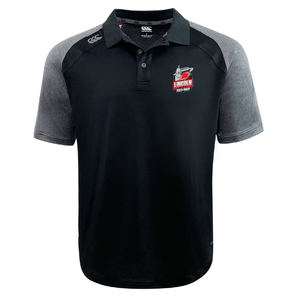 The Lincoln City Youth Rugby Elite Polo by EMB Canterbury features black and gray short sleeves, the Lincoln Fire & Rescue logo on the left chest, Canterbury logo on the right shoulder, and moisture-wicking Vapodri fabric.