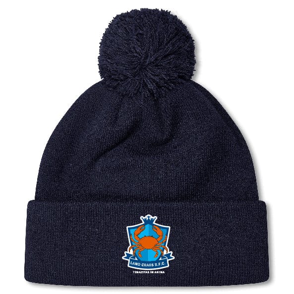The Land Crabs RFC Pom Pom Beanie by EMB Canterbury is a navy blue hat with a pom-pom, featuring a red crab crest and "LAND CRABS F.C." on the folded brim.