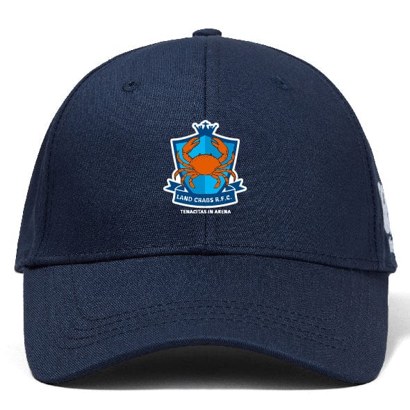 The Land Crabs RFC Flexfit Drill Cap by EMB Canterbury is a navy blue cap with a curved brim, featuring an embroidered crab logo and "LAND CRABS R.F.C." above "EDUCATES IN ARENA" on the front.