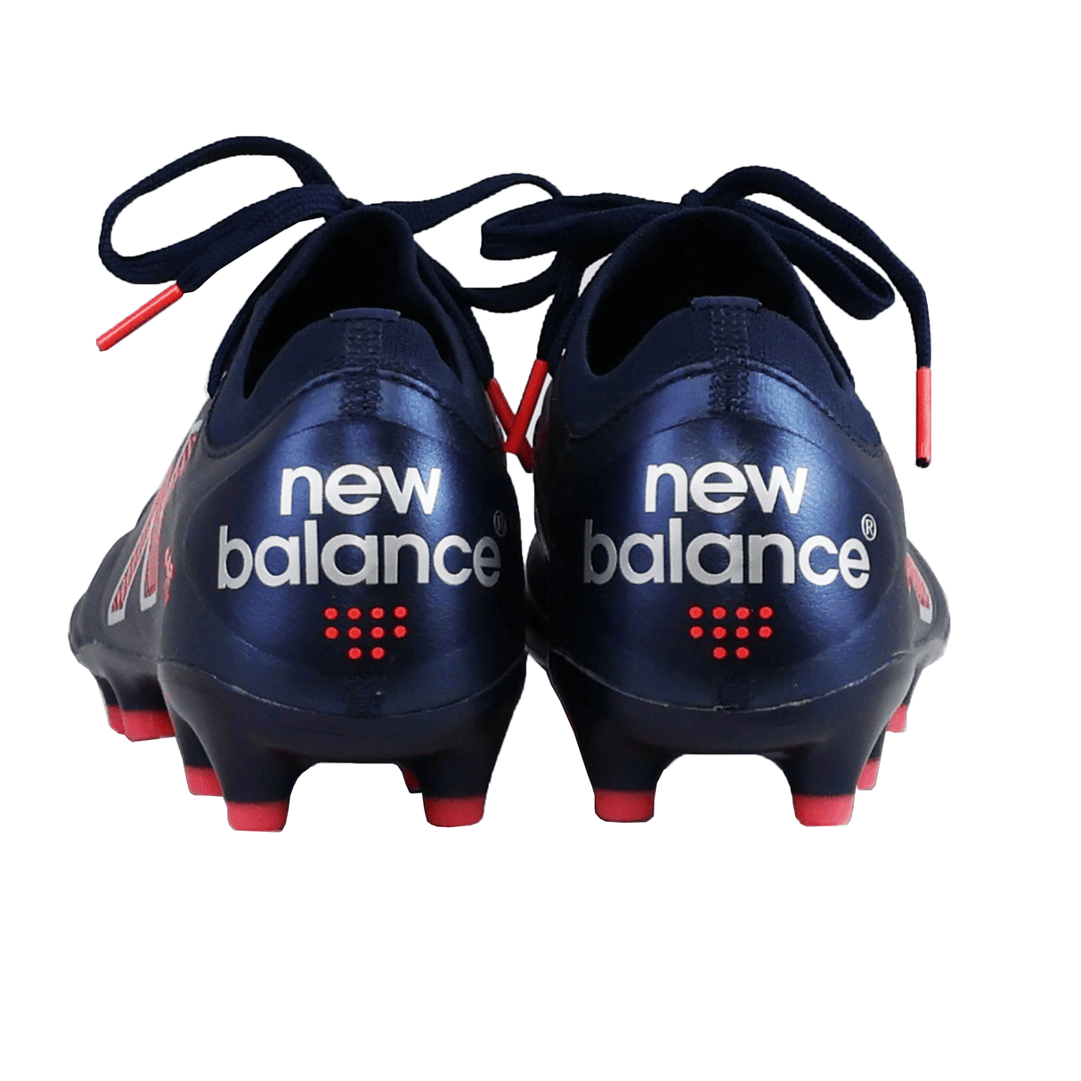 A pair of New Balance 442 v2 Elite FG cleats in navy and energy red, shown from the back with a visible logo and studded soles—designed in premium leather for rugby players seeking top performance and style.