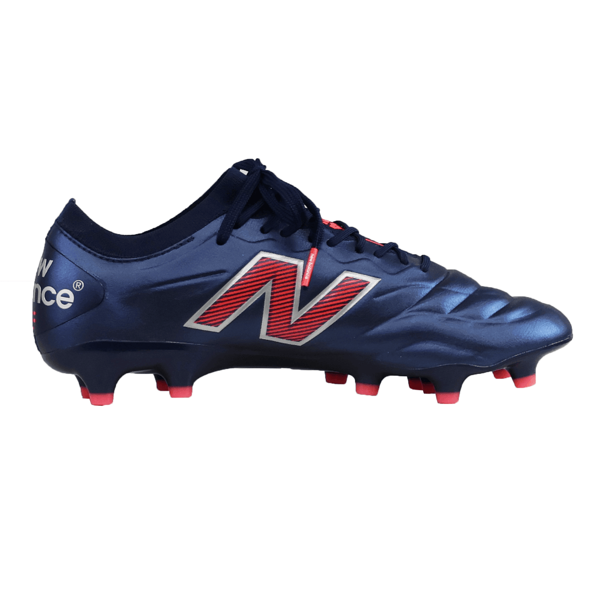 The New Balance 442 v2 Elite FG - Navy/Energy Red soccer cleat, shown in side profile, features a premium leather upper with red and white accents plus eye-catching red-tipped studs.