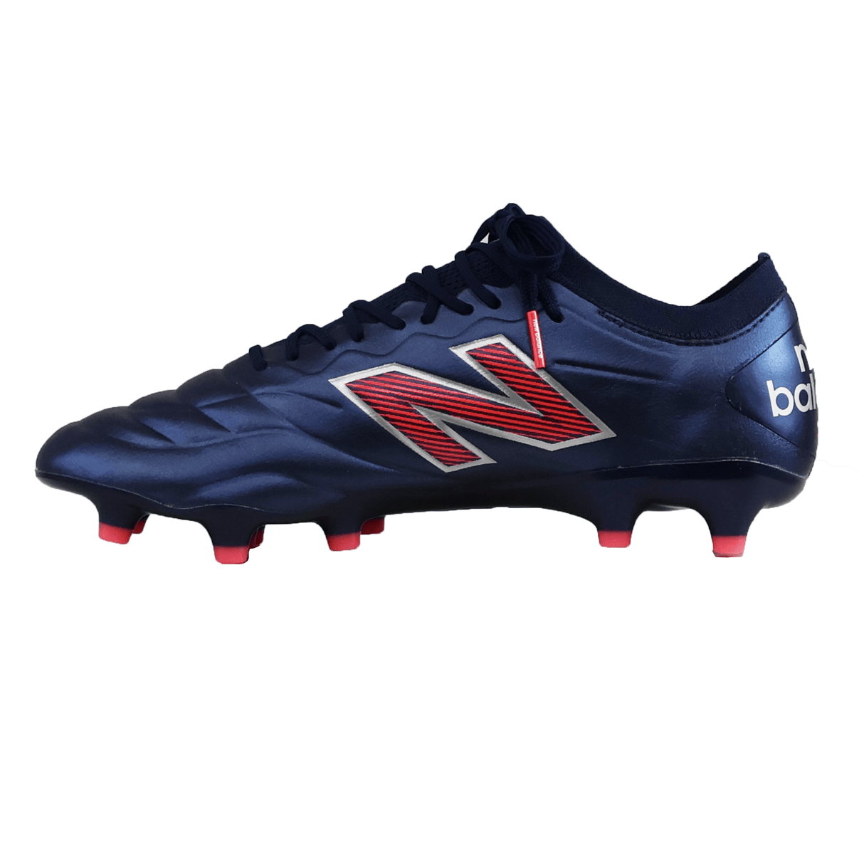 The New Balance 442 v2 Elite FG - Navy/Energy Red soccer cleat features a premium leather upper, red and white accents, and pink-tipped studs, shown from a side view.
