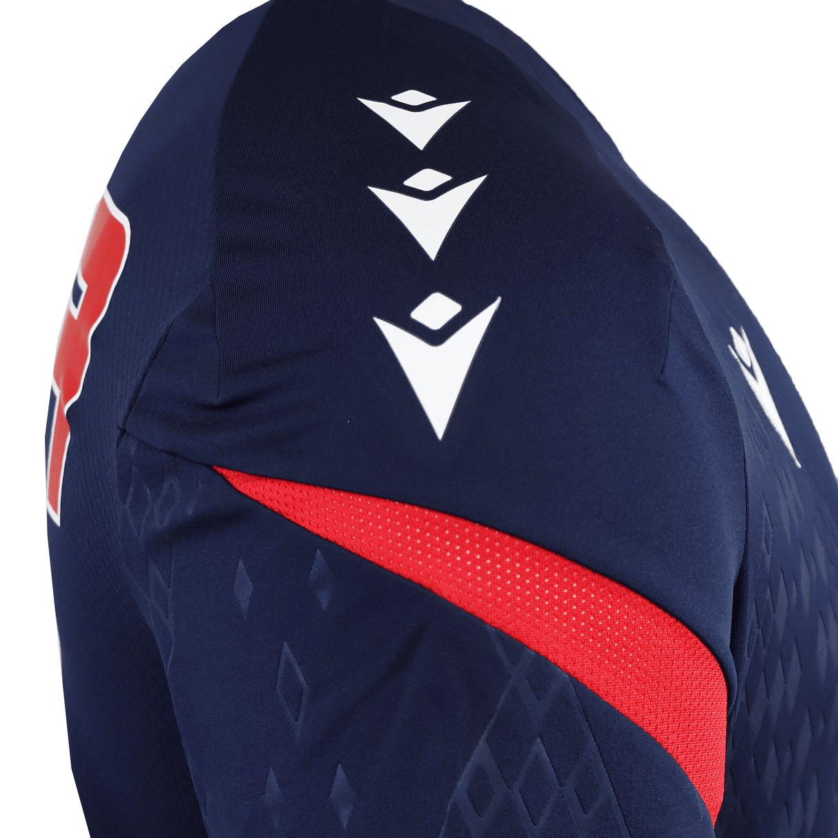 Close-up of the USA Rugby 25/26 Training Poly Shirt by Macron, in navy blue Poly Dry fabric, with a red stripe, diamond pattern, and three white geometric shoulder logos.