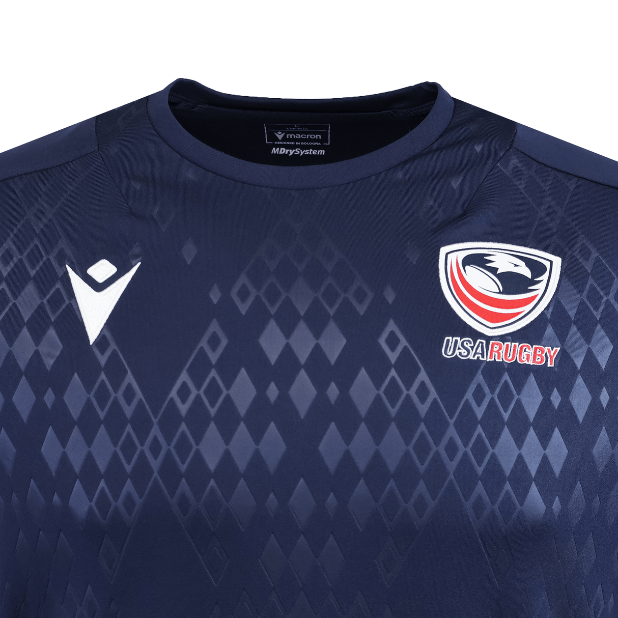 Close-up of the USA Rugby 25/26 Training Poly Shirt by Macron, showcasing the navy design with USA Rugby and Macron logos, plus a diamond pattern on durable Poly Dry fabric.