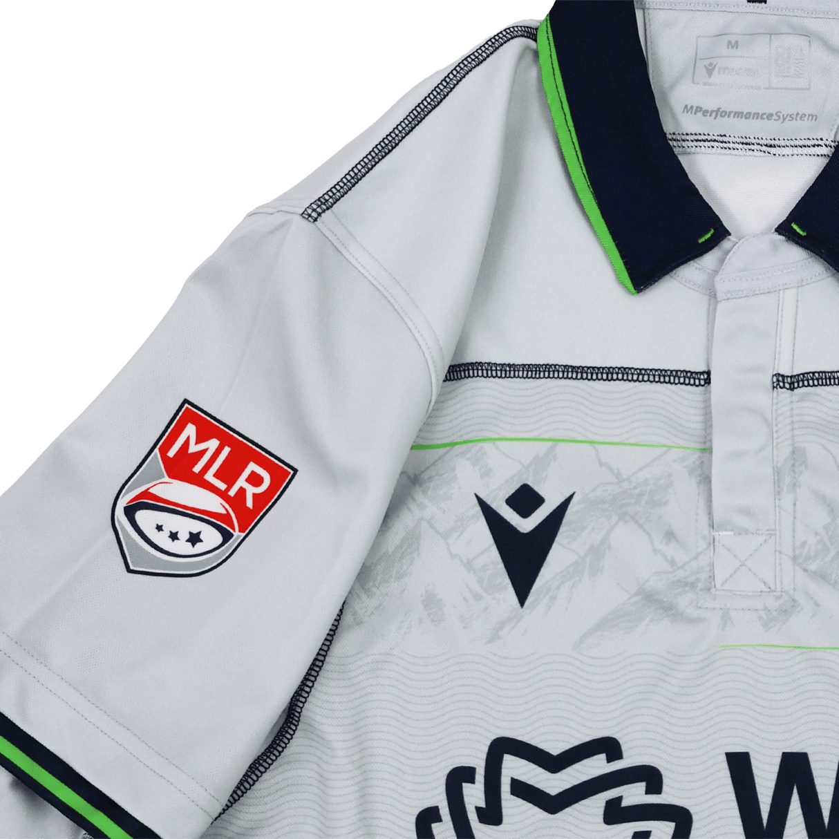 The Seattle Seawolves MLR 25/26 Replica Away Jersey by Macron features white fabric with dark blue and neon green trim, a Macron logo on the chest, and an MLR patch on the sleeve.