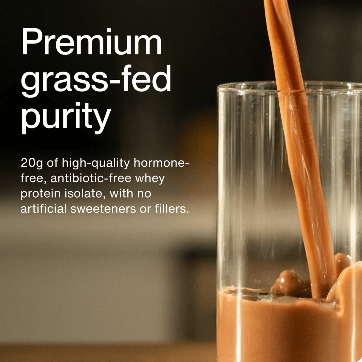 Momentous Grass Fed Whey - Chocolate is poured into a clear glass, showcasing its grass fed whey isolate for optimal protein recovery—hormone-free and antibiotic-free. 25 servings per tub by Momentous.