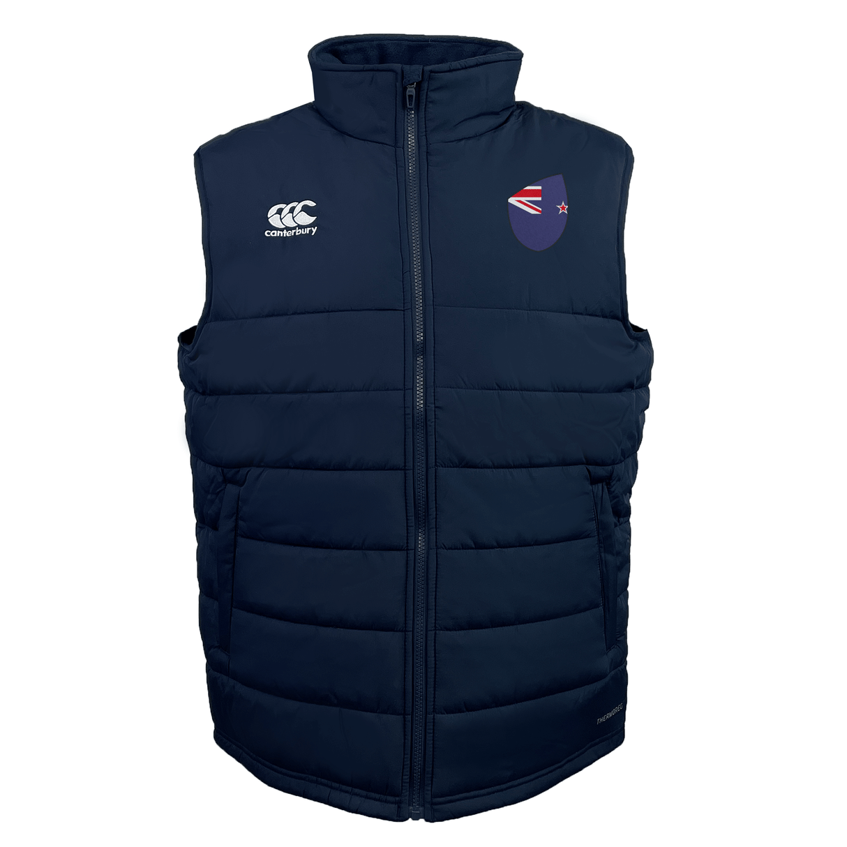 The EMB Canterbury New Zealand Shield Core Gilet is a navy quilted vest with a high collar, small logos on the chest, Vaposhield for weather resistance, and Thermoreg insulation for warmth. It features a front zip closure for convenience and style.