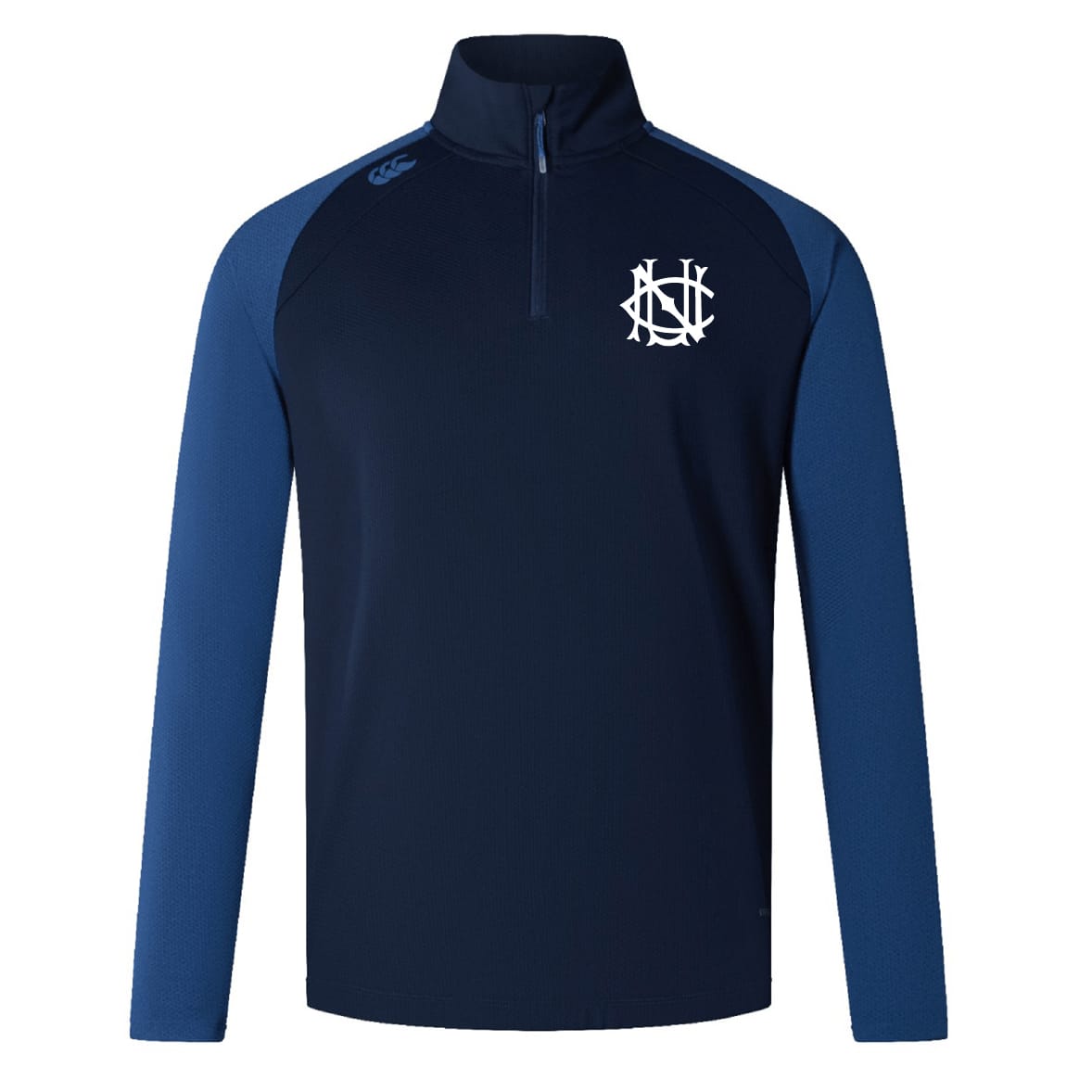 The UNC Rugby Elite First Layer by EMB Canterbury is a navy long-sleeve training top with contrasting blue sleeves, a quarter-zip front, VapoDri technology for comfort, and a white embroidered logo on the left chest.