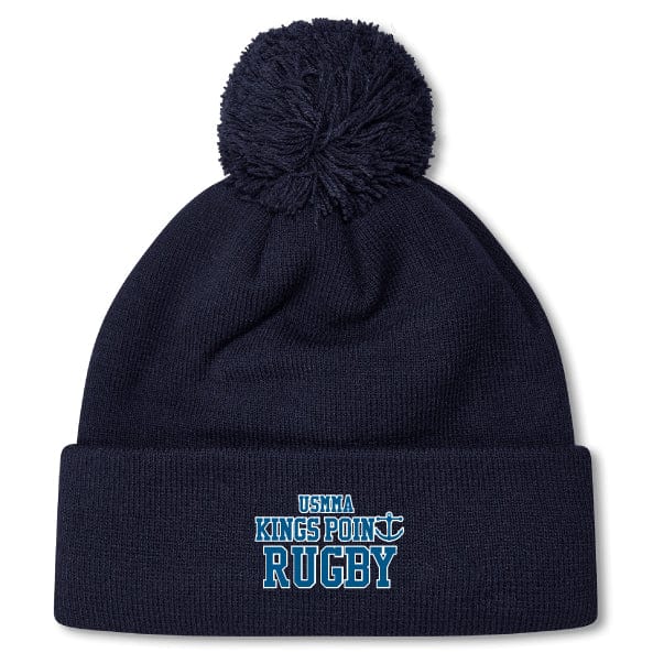 A navy blue King's Point Rugby Pom Pom Beanie by EMB Canterbury, featuring "USMMA Kings Point Rugby" embroidered on the front.