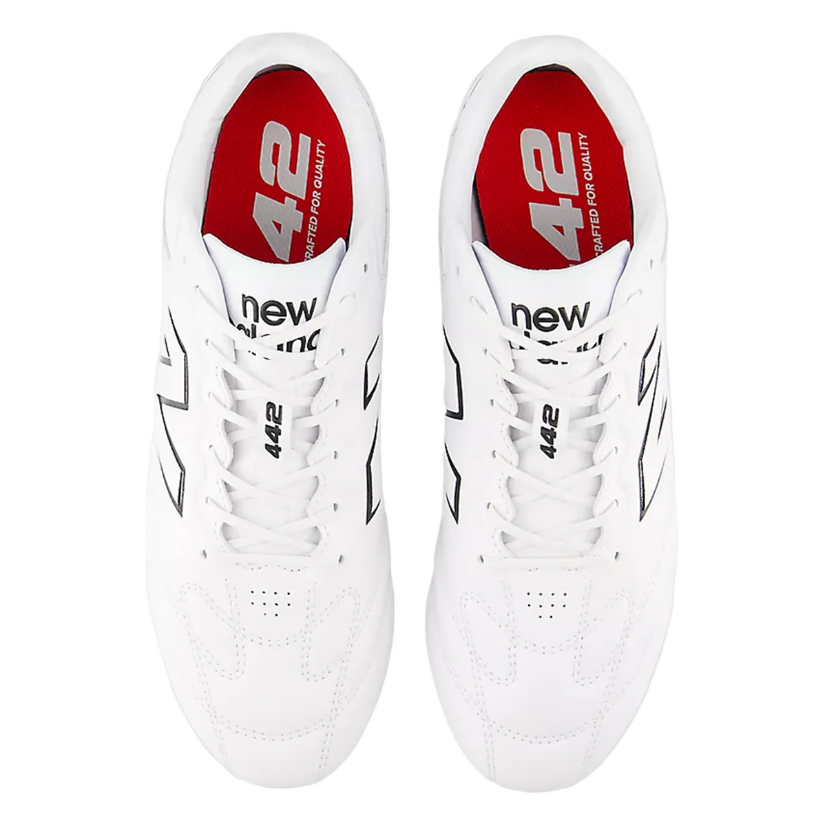 A pair of New Balance 442 Pro FG v3 soccer cleats in white and black, designed for firm ground, viewed from above.