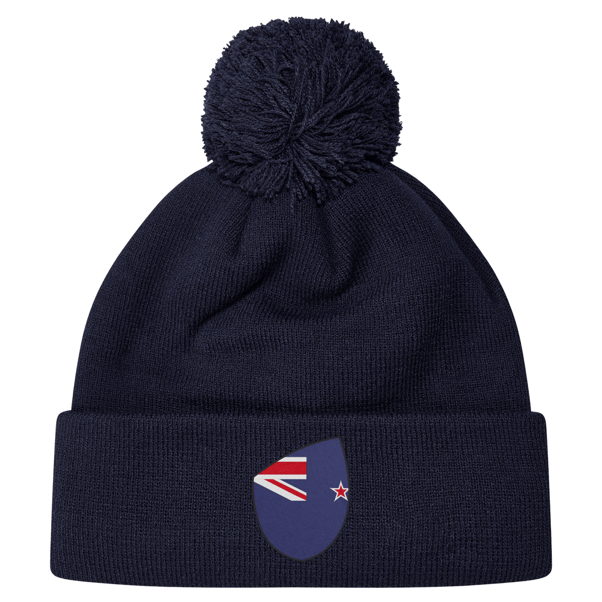 The EMB Canterbury New Zealand Shield Pom Pom Beanie is navy blue with a stylish pom-pom and features a small New Zealand shield emblem on the front.
