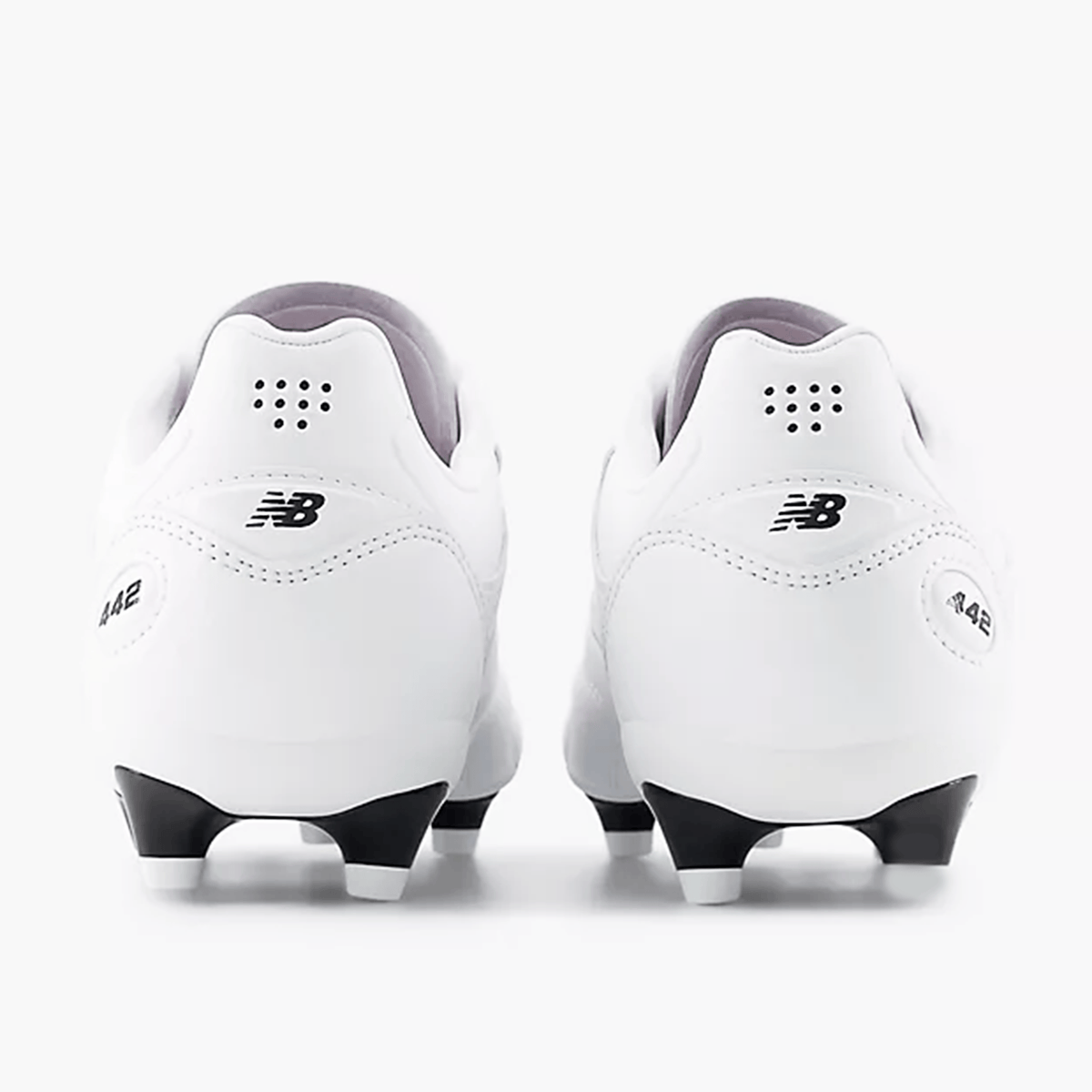 Rear view of two white New Balance 442 Pro FG v3 Rugby Boots with black soles and studs, featuring the “NB” logo and “442” text on the heels. These stylish boots showcase a premium True Touch upper from New Balance for enhanced control and feel on the pitch.