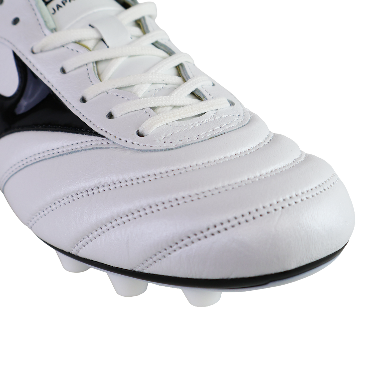 Close-up of the Mizuno Morelia II FG Made in Japan - White/Black/Red football boot, highlighting its black accents, white laces, fine stitching, and sole studs—showcasing Mizuno's renowned Japanese craftsmanship.