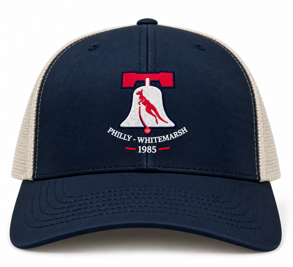 Philly Whitemarsh RFC Retro Trucker Cap in navy blue and beige, featuring an embroidered Liberty Bell silhouette, a red kangaroo, and the text “Philly-Whitemarsh 1985.”.