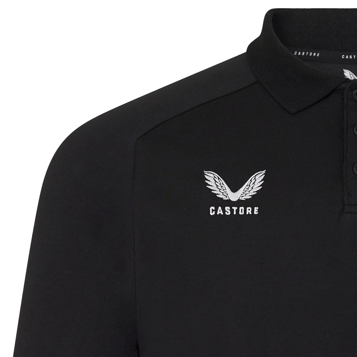 Close-up of the England 26/27 Off-Pitch Polo by Castore, featuring a black design with white Castore logo and brand name on the left chest, plus a three-button placket and collar—ideal for versatile off-pitch style.