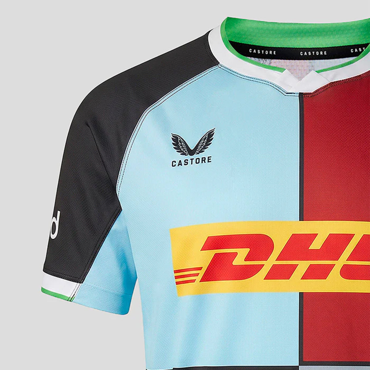 Close-up of the Harlequins 26/27 Replica Home Jersey by Castore, showcasing blue, black, maroon, and green panels with Castore and DHL logos on the chest.