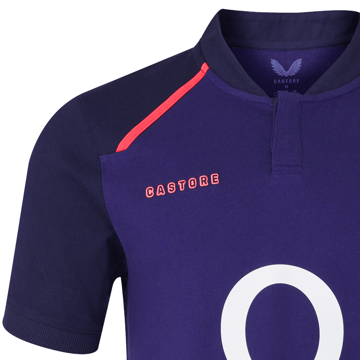A close-up of the Castore England 26/27 Classic Alternate Jersey shows navy blue fabric, a bold red shoulder accent, and the number "0" partially visible on the front.