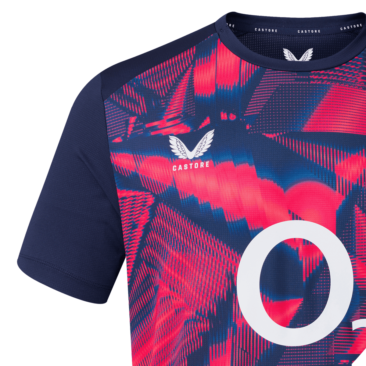Close-up of the England 26/27 Pre-Match Top by Castore, showcasing bold red and blue abstract patterns, navy sleeves, a white "O" on the front, and the Castore logo near the collar.
