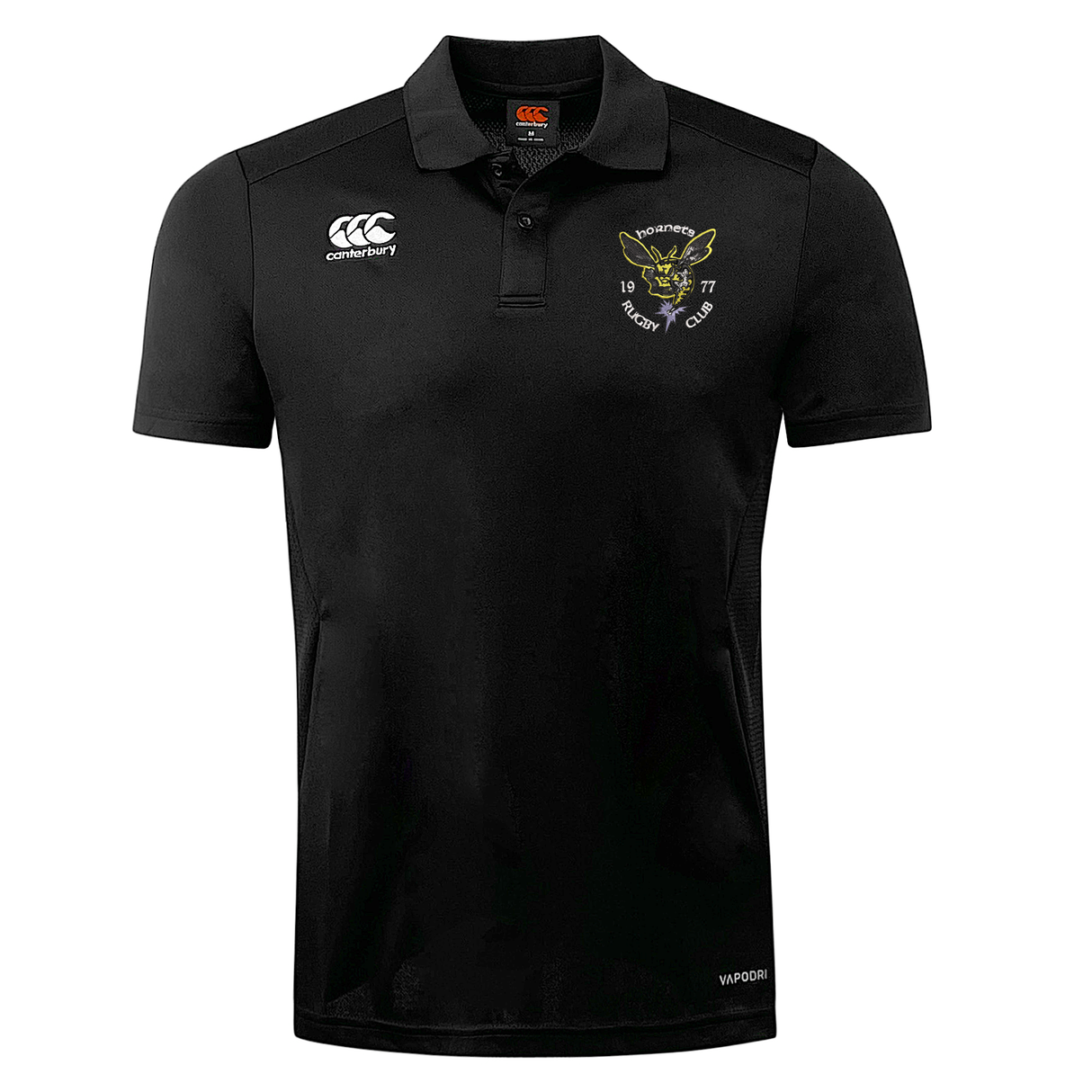 Black Hornets Rugby Club 1977 Dry Polo shirt by EMB Canterbury featuring a collar, short sleeves, and two logos on the chest: one with the Canterbury brand and another showcasing a leaping hornet and “Hornets Rugby Club 1977.” Designed with Vapodri Technology for a breathable polo that keeps you cool and comfortable both on and off the field.