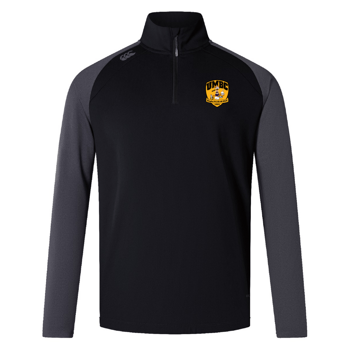 The EMB Canterbury UMBC Rugby Women's Elite First Layer is a black and gray long-sleeve pullover with a half-zip made from honeycomb fabric. It features a UMBC logo on the chest and VapoDri technology for superior moisture-wicking performance.