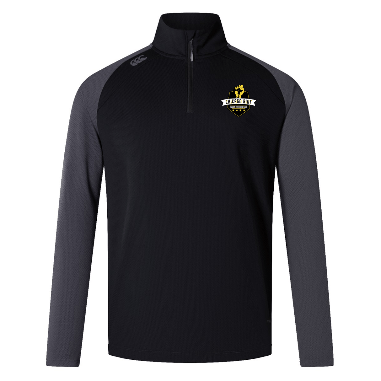The EMB Canterbury Chicago Riot Elite First Layer is a black and dark gray long-sleeve quarter-zip pullover inspired by rugby training tops, featuring a "Sheecs Folk" crest logo on the left chest.