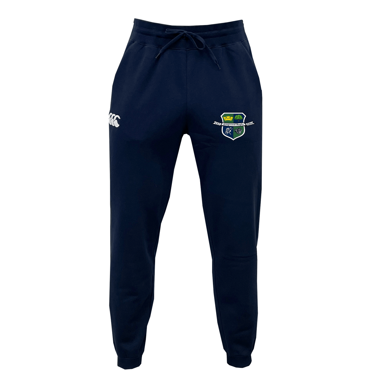The Kingwood Rugby Leisure Sweatpant by EMB Canterbury is a navy blue jogger made from recycled polyester fleece, featuring a drawstring waist, side pockets, a white Canterbury logo on the right, and an embroidered crest on the left thigh.