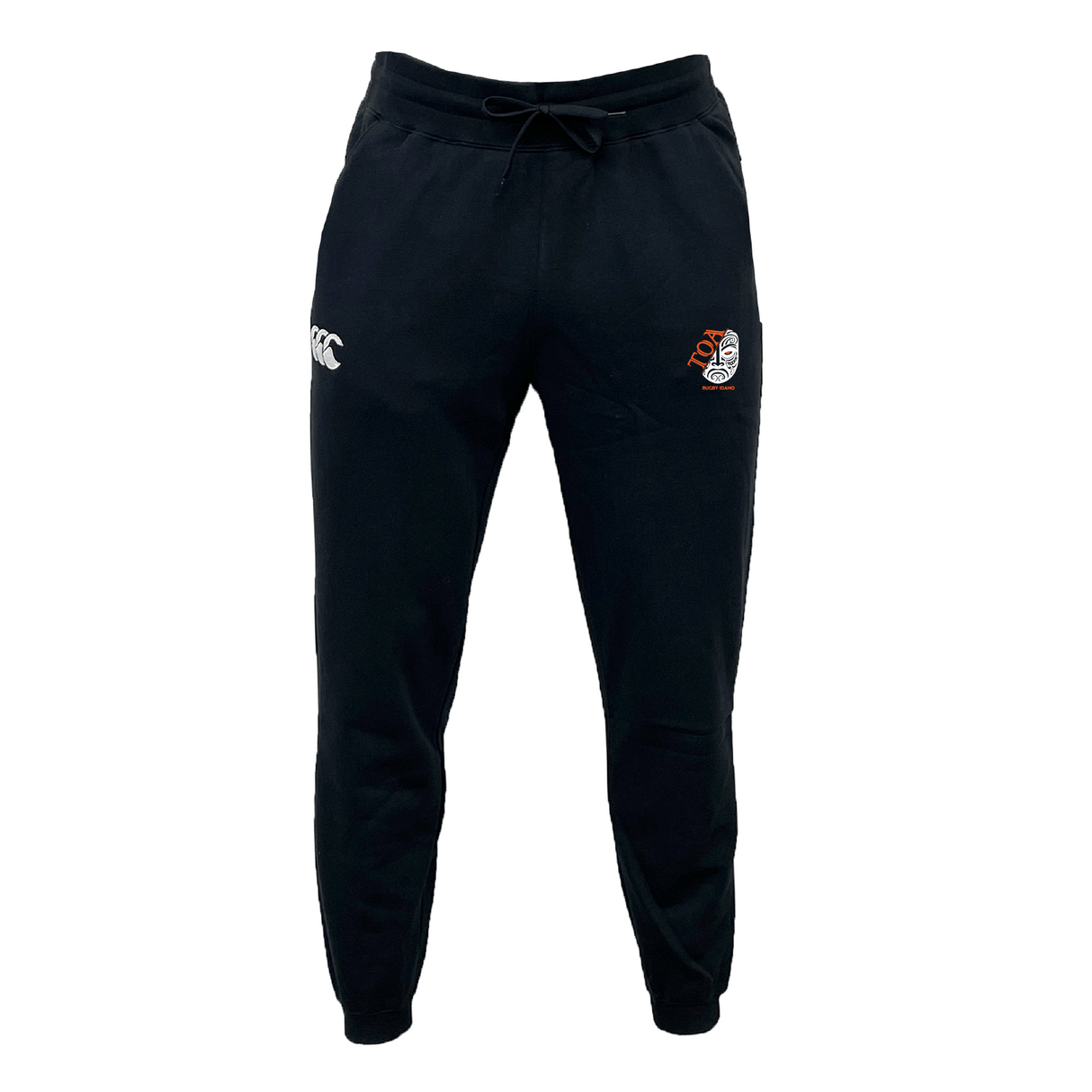 The Toa Rugby Idaho Leisure Sweatpant by EMB Canterbury features black track pants made from recycled polyester fleece, with a left-side embroidered Canterbury logo and a right-side red and white crest.