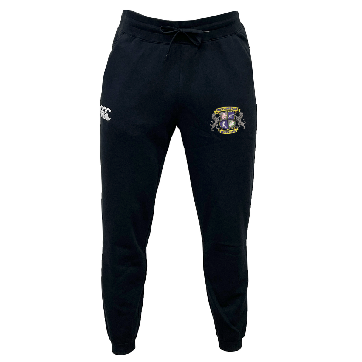 The EMB Canterbury Winchester Cannons Leisure Sweatpant is black with a drawstring waist, made from recycled polyester fleece, featuring a white Canterbury logo on the left thigh and a colorful crest emblem on the right.