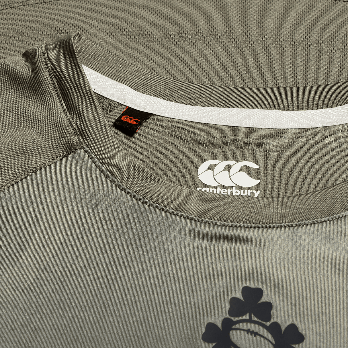 A close-up of the Ireland 25/26 Superlight Training T-Shirt by Canterbury shows the logo on the chest and collar label—a breathable sports tee from Canterbury, perfect for active sessions.