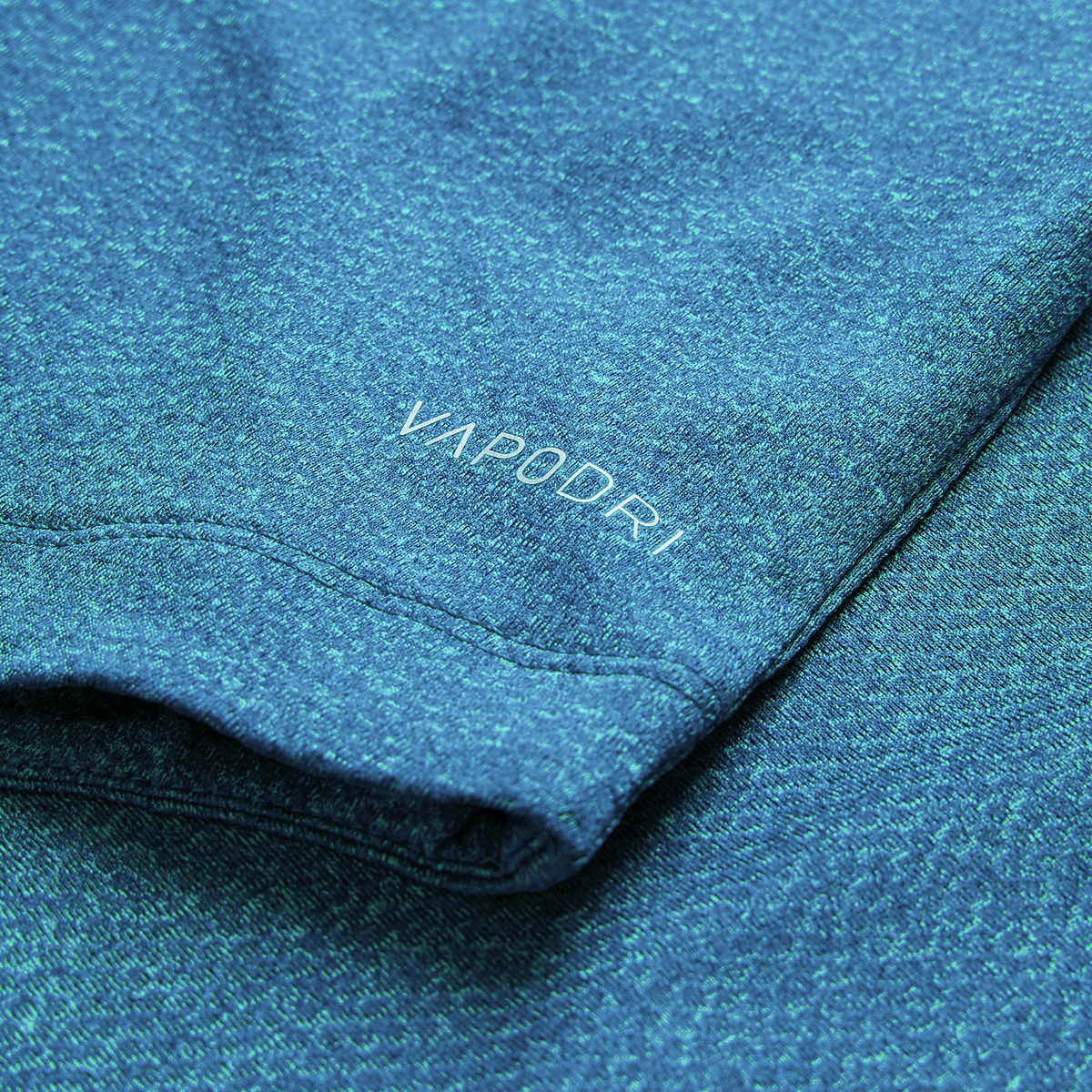 Close-up of the Ireland 26/27 Summer Tour Elite Training Tee by Canterbury in blue heather, featuring "VAPODRI" printed on the sleeve—highlighting top performance and quality for Ireland rugby fans.