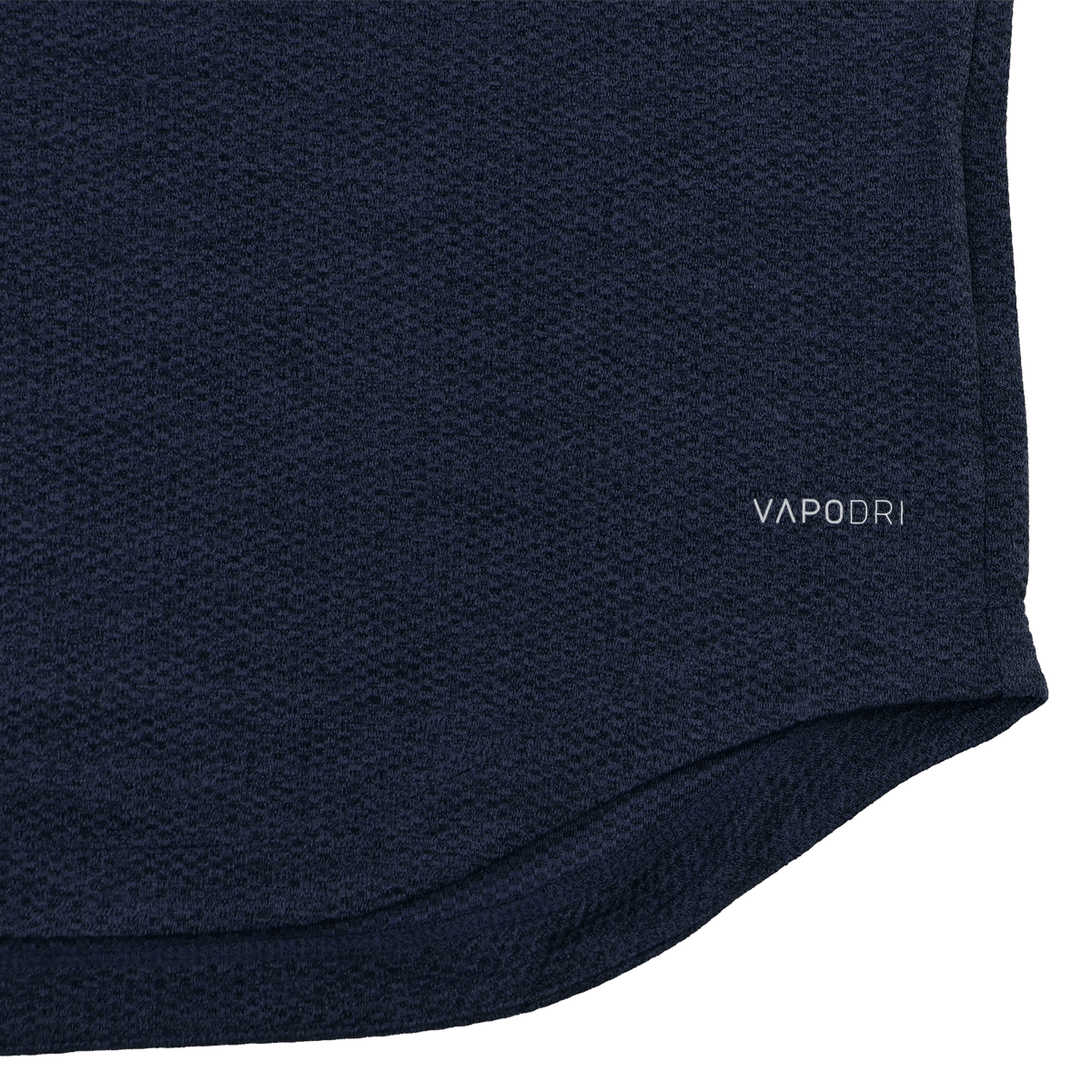 Close-up of the Ireland 26/27 Summer Tour Elite First Layer by Canterbury in navy blue textured fabric featuring Vapodri technology, with "VAPODRI" printed near the hem—a must-have for elite performance.