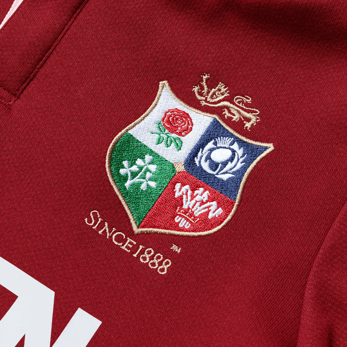 The Youth British & Irish Lions 2025 Long Sleeve Classic Jersey by Canterbury features a detailed embroidered crest with "Since 1888" and is made from red, moisture-wicking fabric, ensuring comfort and style for young fans.