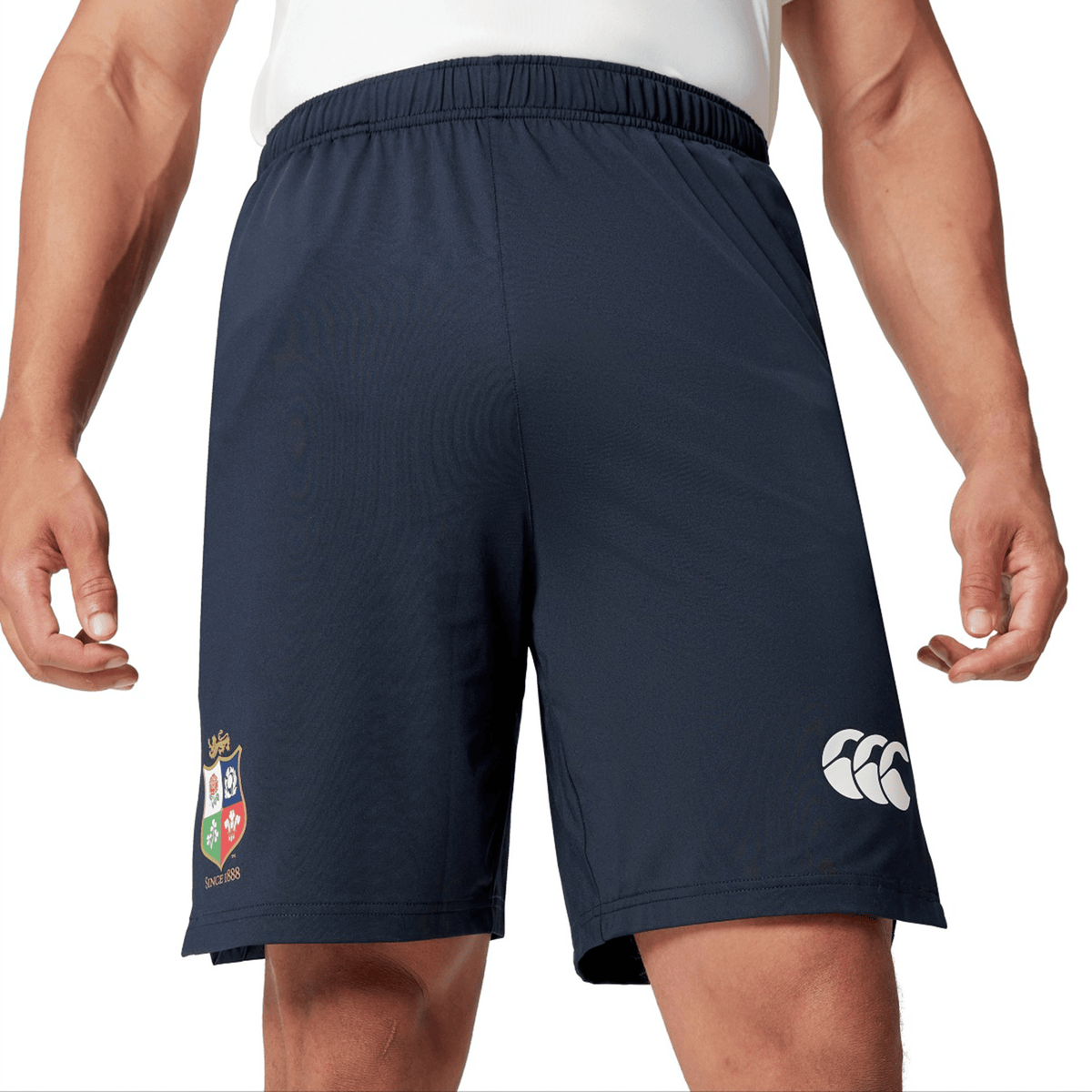 An individual dressed in navy British & Irish Lions 2025 Training Shorts by Canterbury, showcasing the sports logo on the left leg.