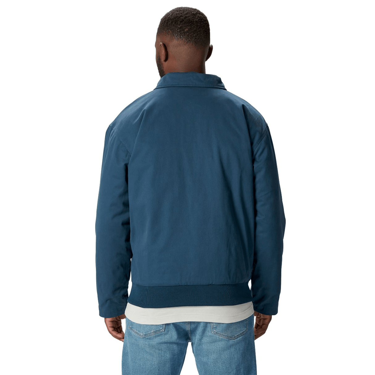 A person wearing the British & Irish Lions 2025 Heritage Quilted Jacket by Canterbury with jeans is shown from the back against a plain white background, showcasing the classic style associated with Canterbury and the British & Irish Lions.