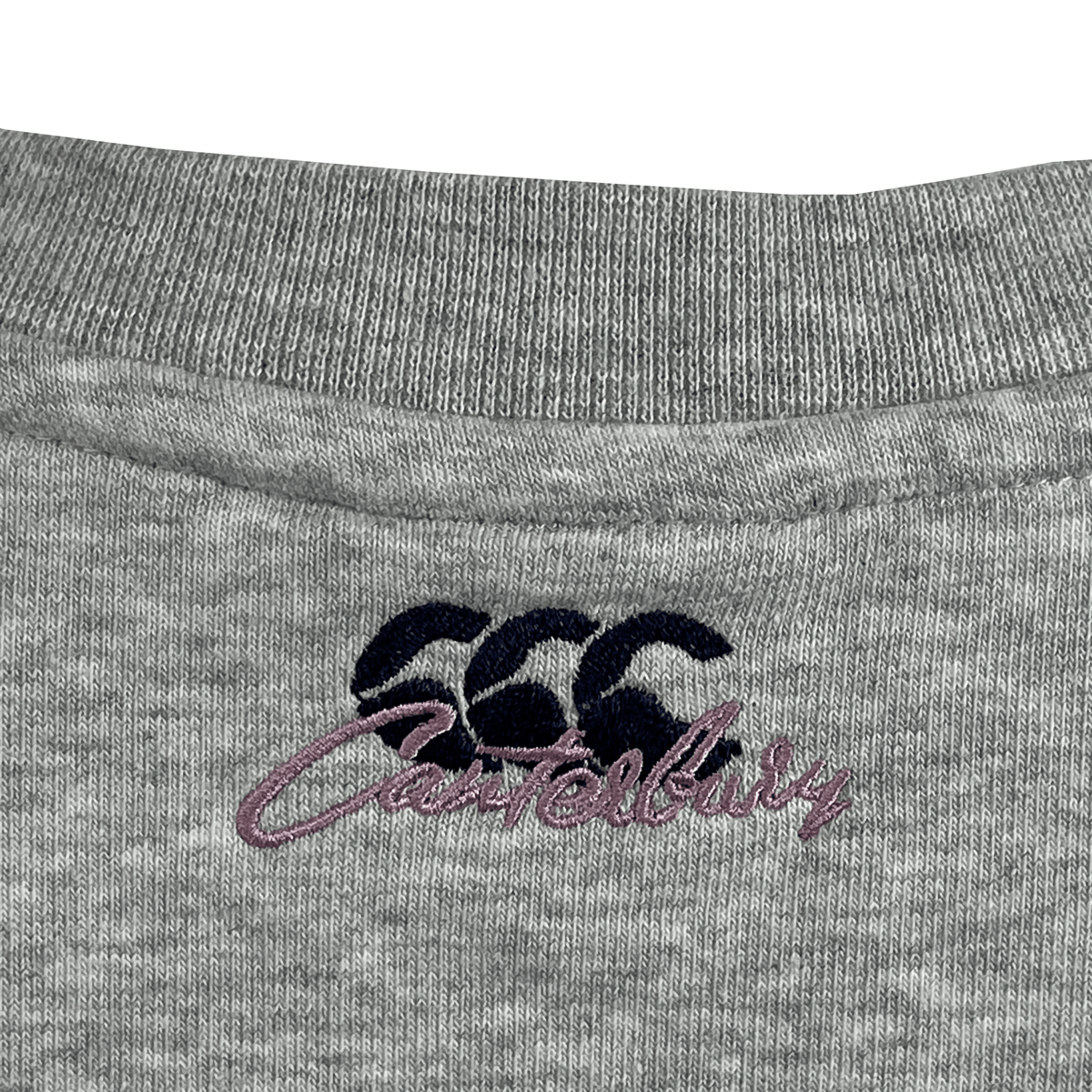 The relaxed fit Women's Canterbury Scene Set Crew Sweatshirt neckline showcases a blue "CCC" logo and "Canterbury" in purple script, with rib knit cuffs and hem enhancing its casual elegance.