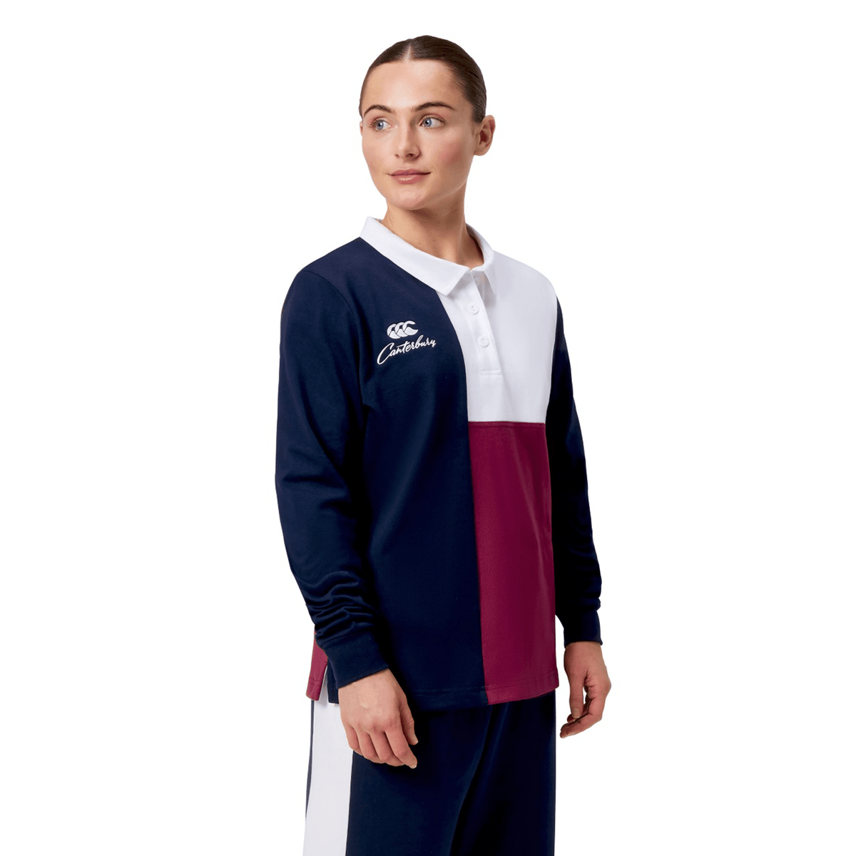 Wearing the Women's Canterbury Harlequin Weber Long Sleeve Rugby Jersey with navy, white, and maroon color blocks and branded embroidery featuring the Canterbury logo.
