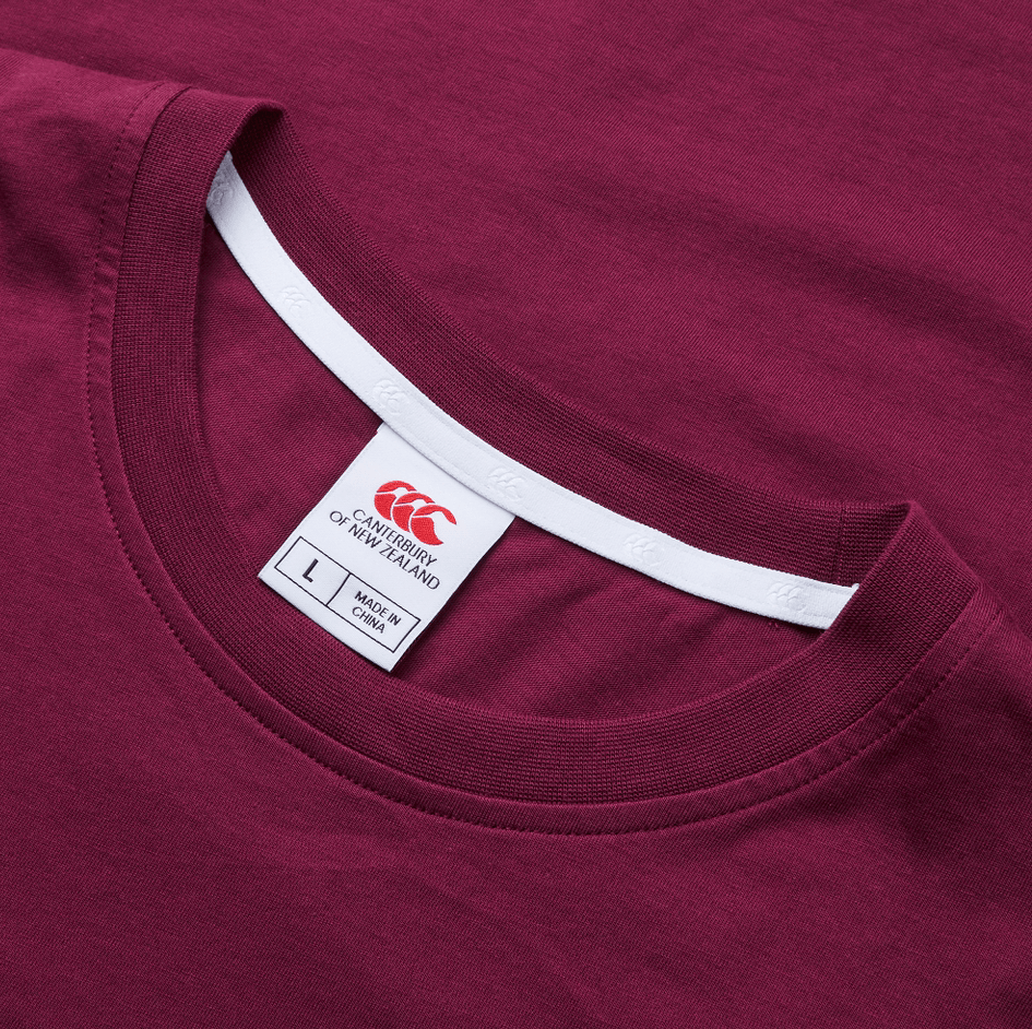 The Canterbury Fundamental T-Shirt in maroon features a visible neckline with a white label indicating size L and "Made in China." This classic fit tee showcases the distinctive CCC logo, blending comfort with style seamlessly.